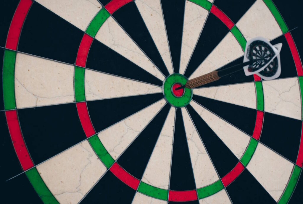 A dart in the bullseye of a dartboard