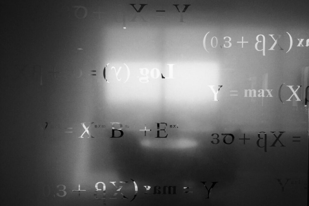 Close up of various equations on a board